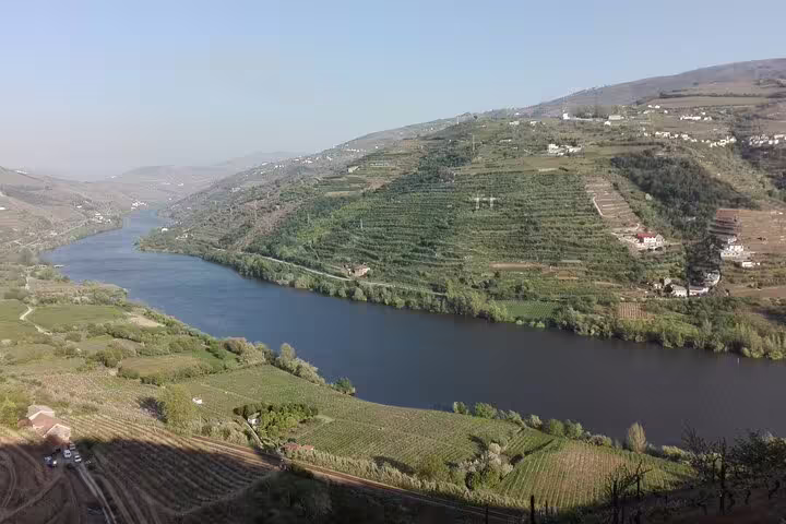 Panoramic Douro River and terraced vineyards view on 2-day private tour from Lisbon to Porto via Douro Valley