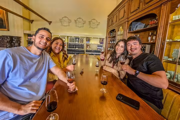Friends tasting Douro wines at a winery, part of private Porto to Lisbon via Douro Valley wine boat brunch