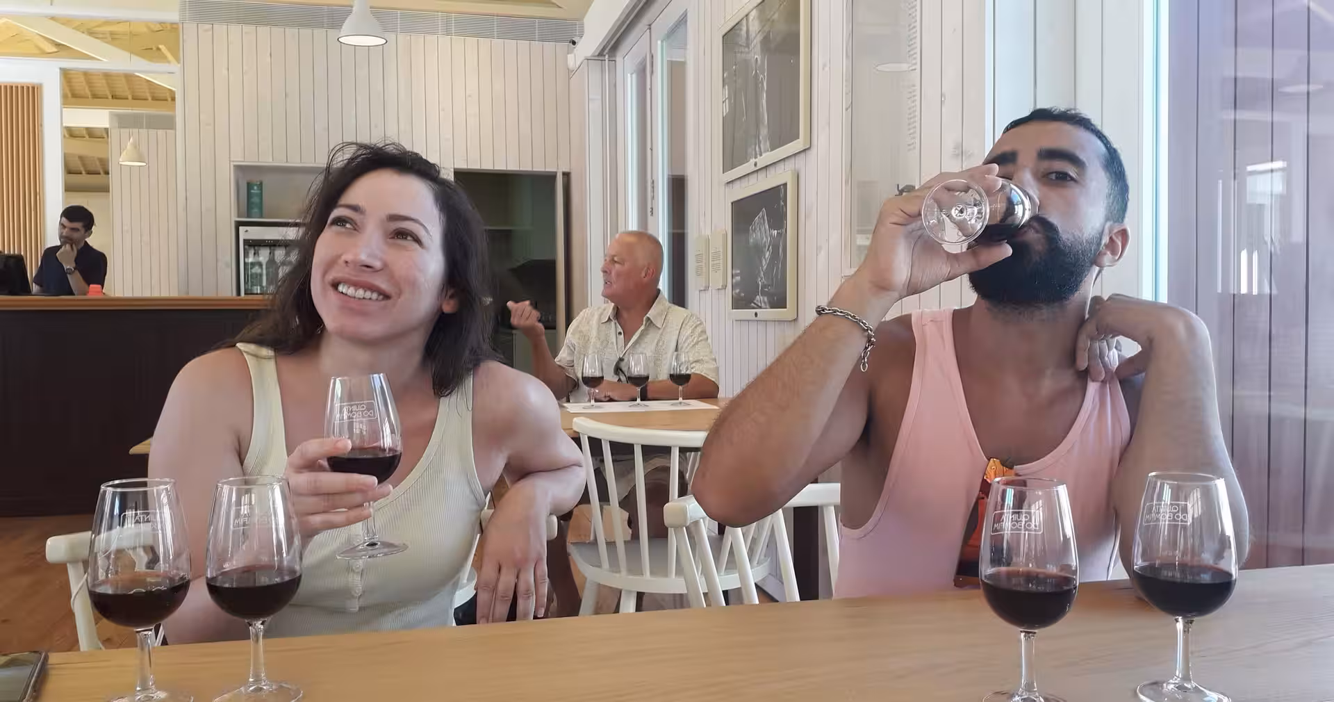 Guests tasting Douro red wines at a winery during the small-group Douro Valley hike from Braga with lunch