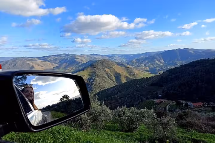 Road trip viewpoint over Douro Valley vineyards and mountains, Portugal wine tour with scenic drives and tastings