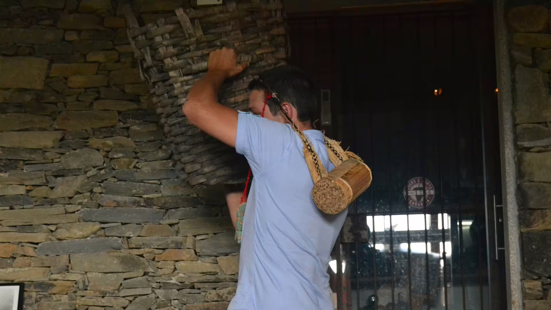 Image of a guide with a big grape basket during a winery visit