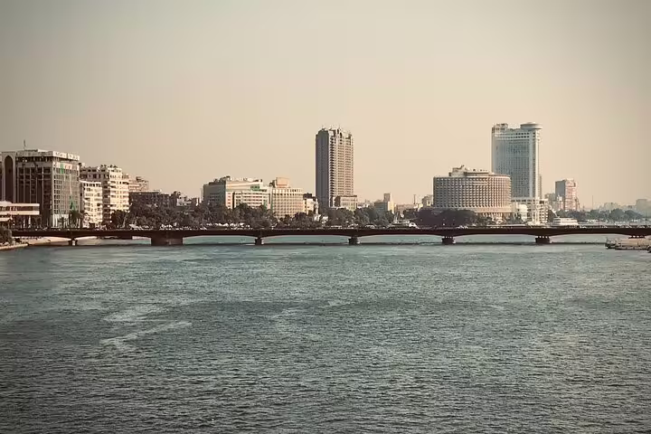 Wide view of the Nile River and downtown Cairo bridges and towers, scenic stop on half-day tour with dinner