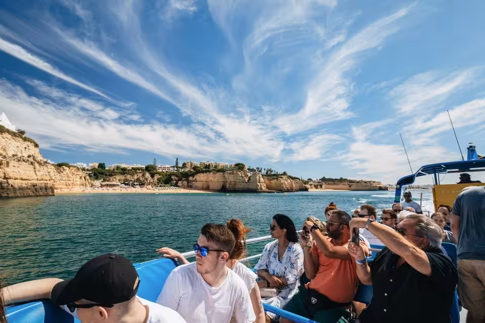 Tour group captures breathtaking Algarve sea cliffs and blue skies on the Dreamer Caves & Dolphin Watching adventure.