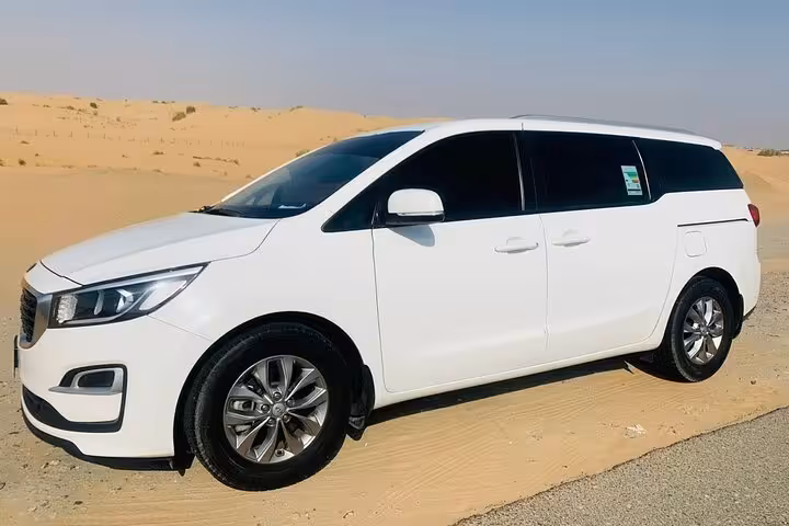 Private Dubai to Abu Dhabi transfer in white minivan, air-conditioned airport pickup and city transport