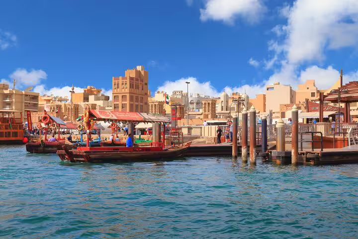 Dubai Creek abra boat at Bur Dubai waterfront, ideal for a private customizable half-day sightseeing tour