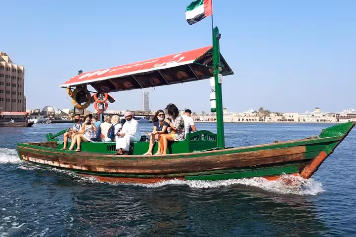 Traditional Dubai Creek abra ride in Deira on Dubai city tour from Ras Al Khaimah, kids under 12 free