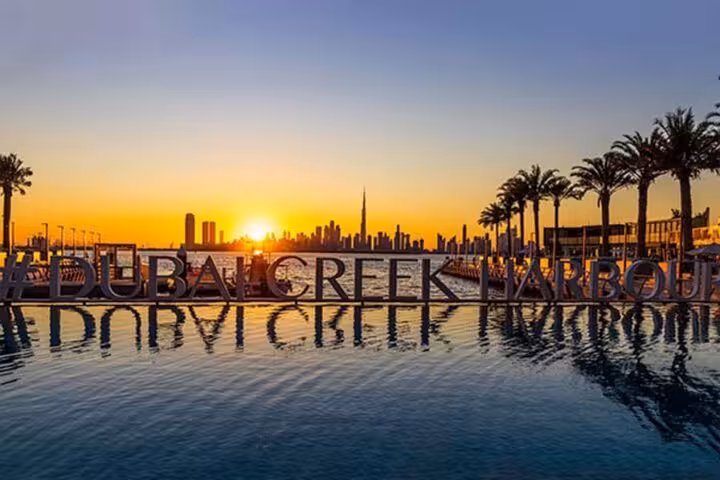 Sunset view at Dubai Creek Harbour with skyline and Burj Khalifa, on Dubai Creek Mall fountains and Old Souk tour