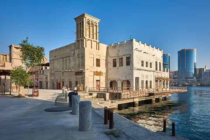 Discover Dubai's historic buildings by the waterfront during a magical day and night private vehicle tour.