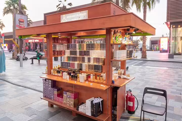 Perfume kiosk on Dubai Marina promenade showcasing Arabic fragrances and oils visited on the guided walking food and culture tour