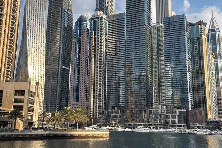Dubai Marina skyline with waterfront yachts on Dubai city tour en route to Ain Dubai entrance