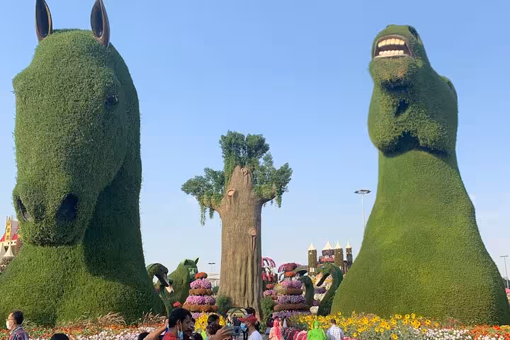 Dubai Miracle Garden topiary sculptures and flower displays on Global Village tour with Fujairah transport