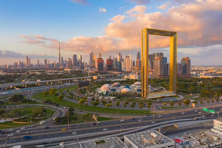 Scenic view of Dubai's skyline with the iconic Dubai Frame, showcasing the blend of old and modern architecture.