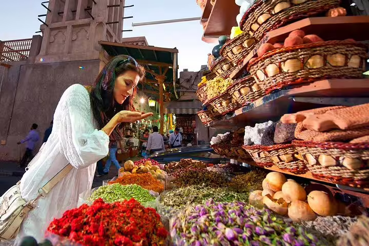Discover vibrant spices at Dubai's traditional souks, a highlight of the magical day and night tour in a private vehicle.