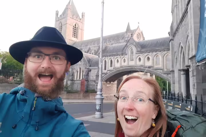 Excited couple taking selfie in front of Christ Church Cathedral Dublin on ghost tour