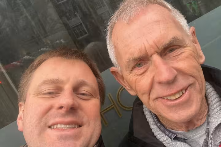 Two smiling men taking a selfie outside a Dublin pub on a self-guided tour