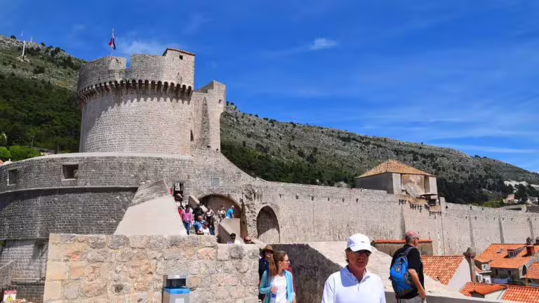 Dubrovnik city walls and fortress walkway with visitors, key Game of Thrones filming location shore excursion