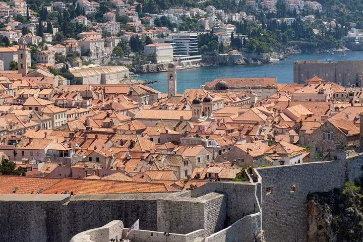 Dubrovnik city walls and terracotta rooftops overlooking the harbor, small group walking tour in Old Town