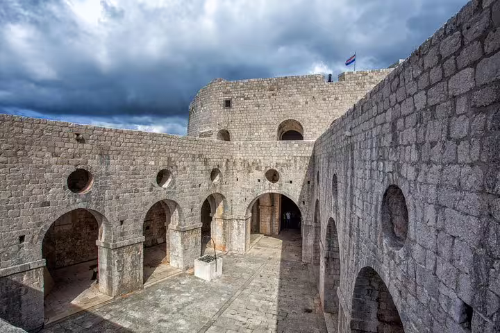 Dubrovnik Fort Lovrijenac stone courtyard, key Game of Thrones filming location on group tour experience