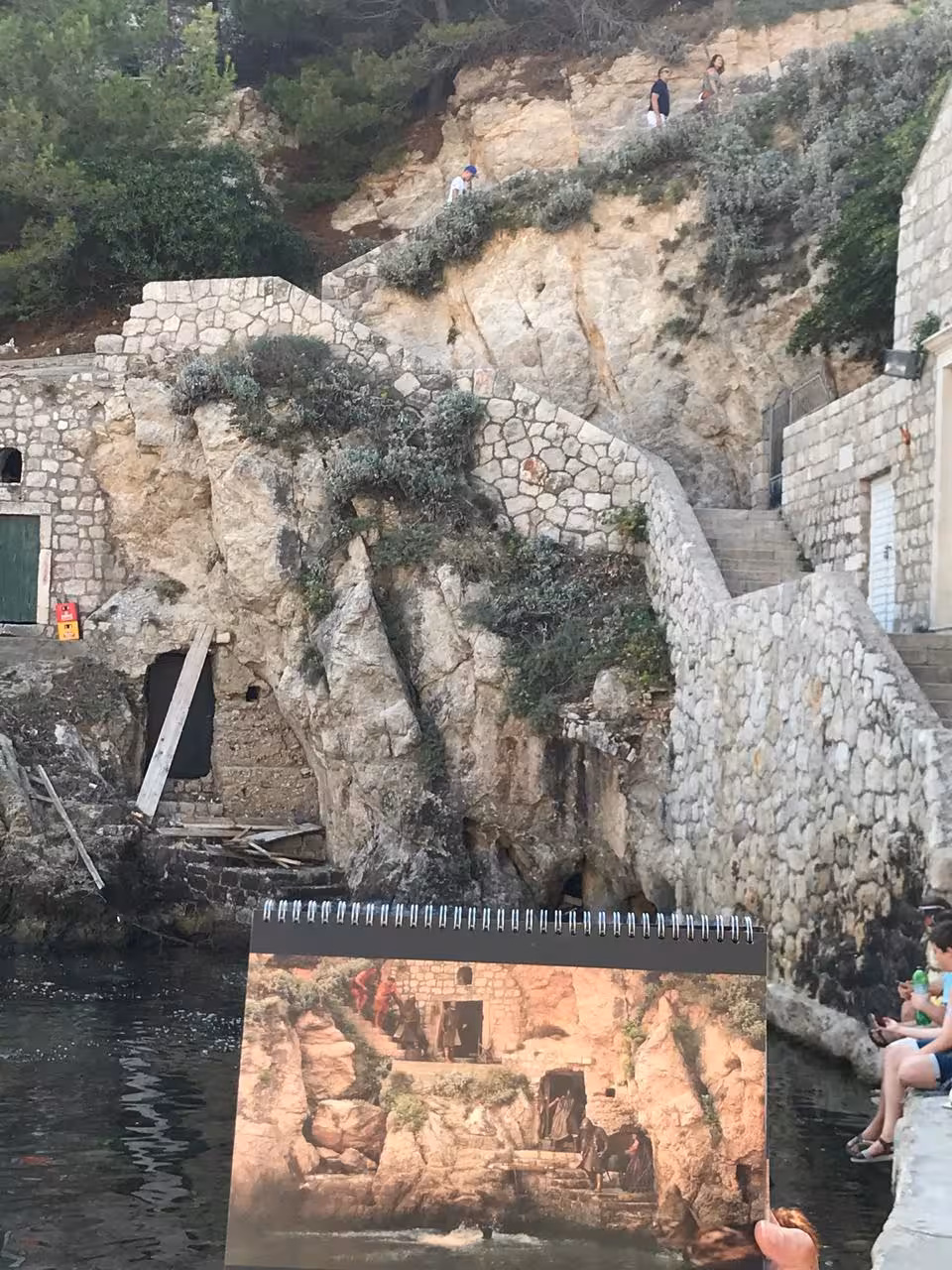 Dubrovnik cliffside steps at a Game of Thrones filming spot, shown with scene still on combo history walking tour