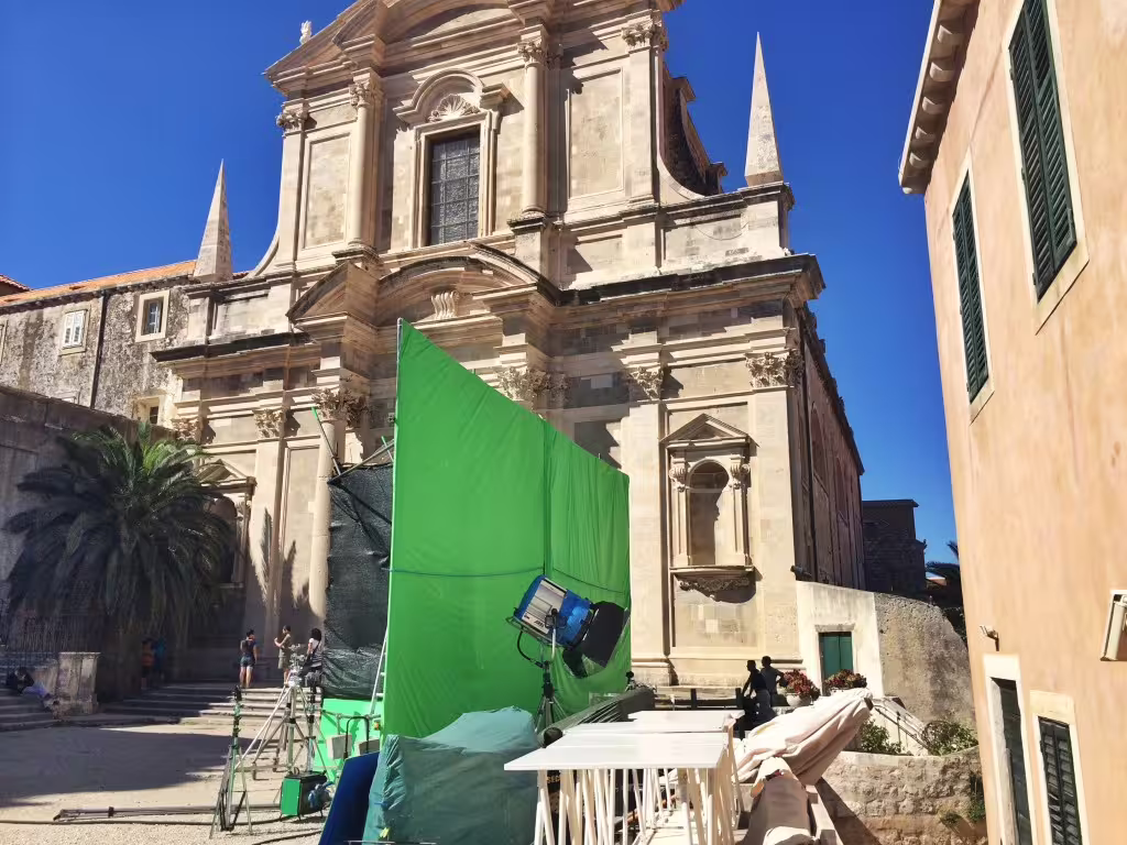 Dubrovnik filming location with green screen set outside historic church on Game of Thrones walking tour