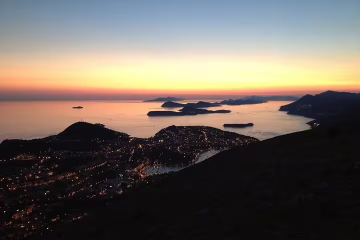 Panoramic sunset over Dubrovnik and Adriatic islands, perfect view on a Dubrovnik by night walking group tour