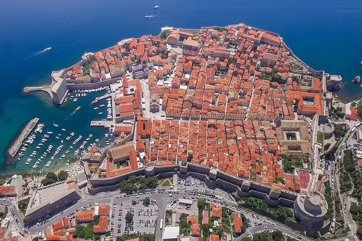 Aerial view of Dubrovnik Old Town and harbor, ideal for an early bird walking group tour in Croatia
