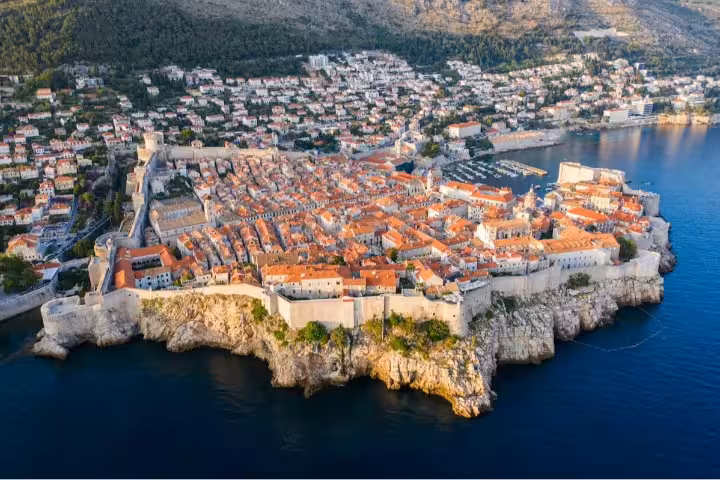 Aerial view of Dubrovnik Old Town walls and red rooftops by the Adriatic Sea on a private guided tour