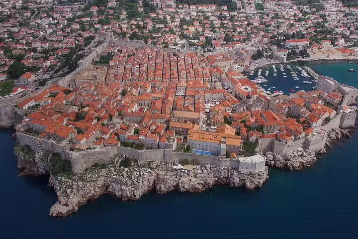 Aerial view of Dubrovnik Old Town walls and terracotta rooftops, highlight of early bird walking group tour