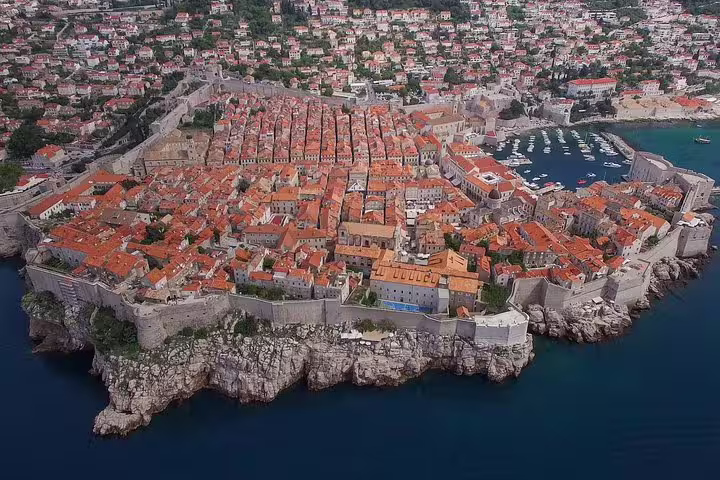 Aerial view of Dubrovnik Old Town and medieval city walls by the Adriatic, highlight of walking group tour