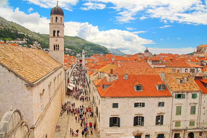 View over Dubrovnik Old Town rooftops and Stradun with bell tower, ideal for private guided walking tour