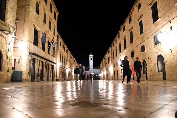 Stradun Street in Dubrovnik Old Town at night with glowing lamps, key highlight on a guided evening walking tour