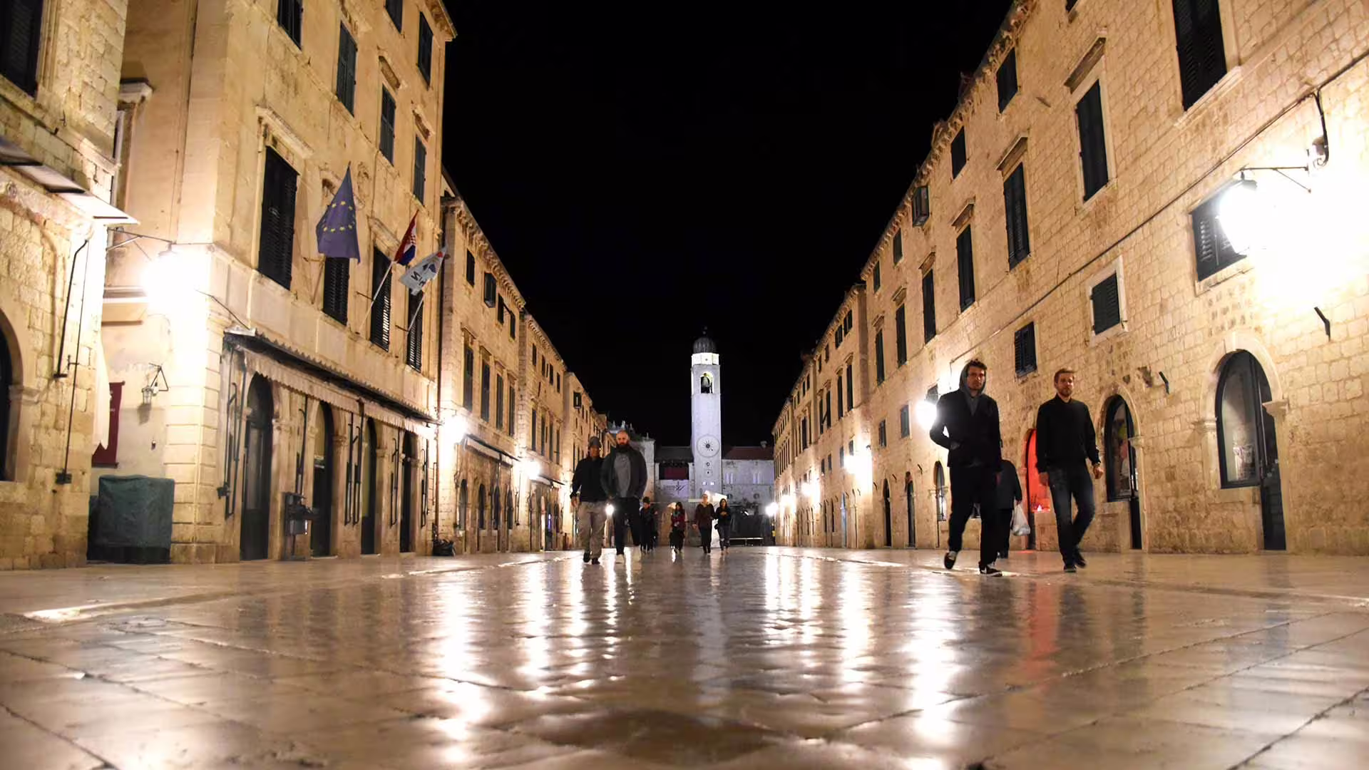 Stradun street in Dubrovnik Old Town at night with glowing lamps, ideal for evening group walking tour