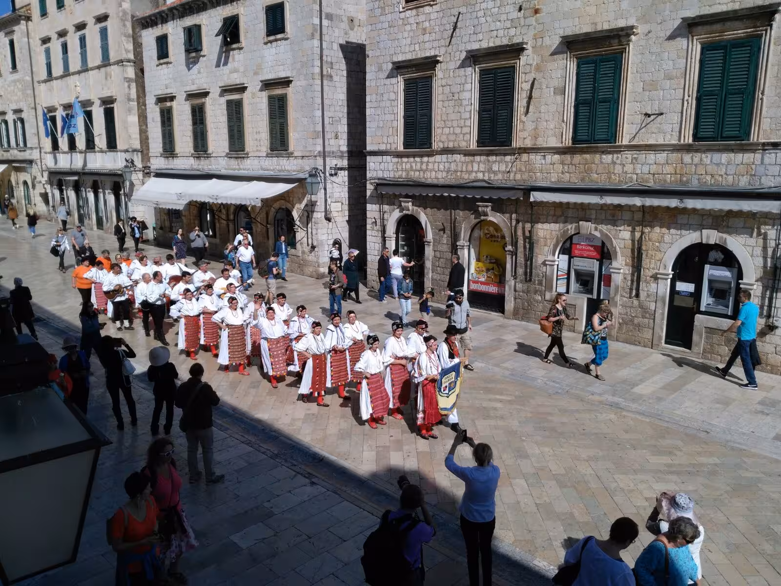 Traditional performers on Stradun in Dubrovnik Old Town, cultural stop on Split to Dubrovnik day tour