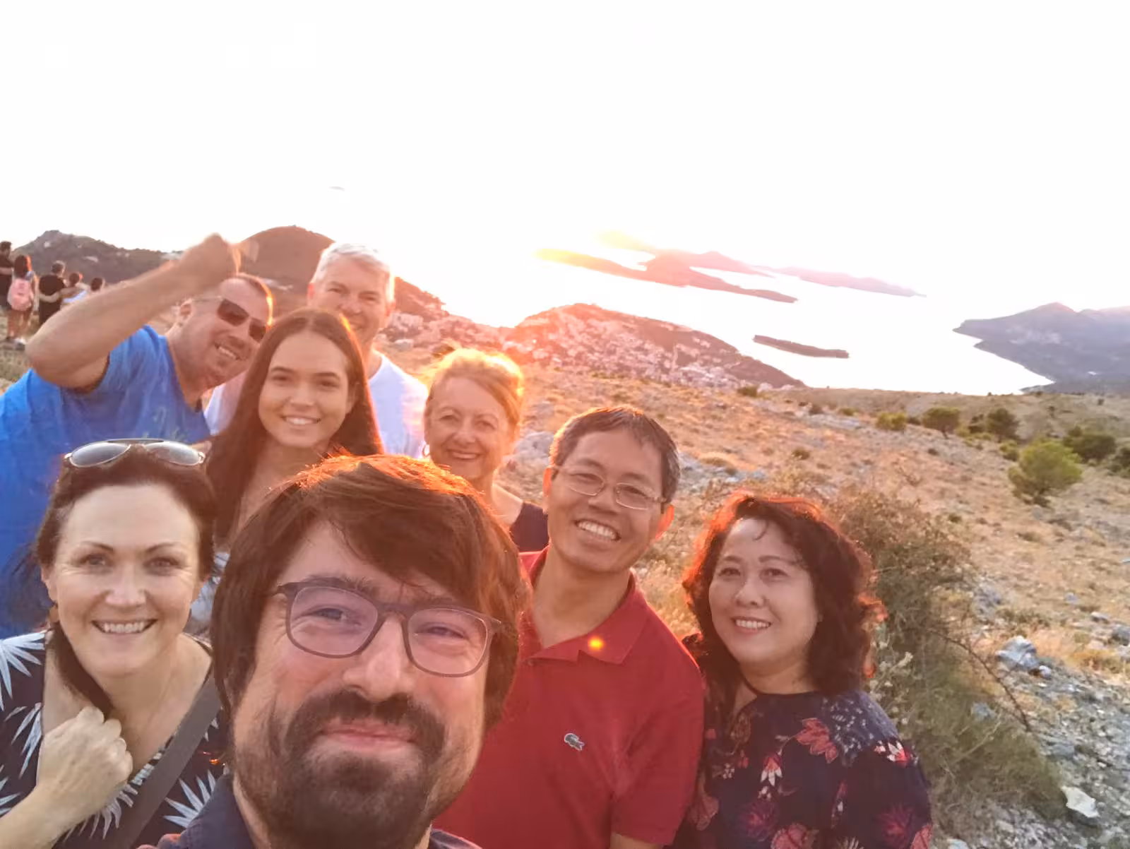 Group selfie at Dubrovnik viewpoint at sunset over Adriatic islands, memorable Split to Dubrovnik day trip