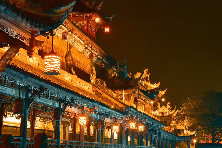 Illuminated traditional architecture at night in Dujiangyan, showcasing the enchanting Blue Tears Night View experience.