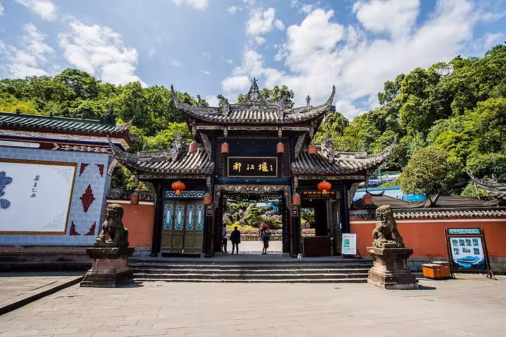 Ornate entrance of Dujiangyan Scenic Area with traditional Chinese architecture, showcased in Dujiangyan Private Tour.