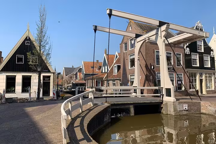 Traditional Dutch drawbridge over canal in a quaint North Holland village on a private tour from Amsterdam