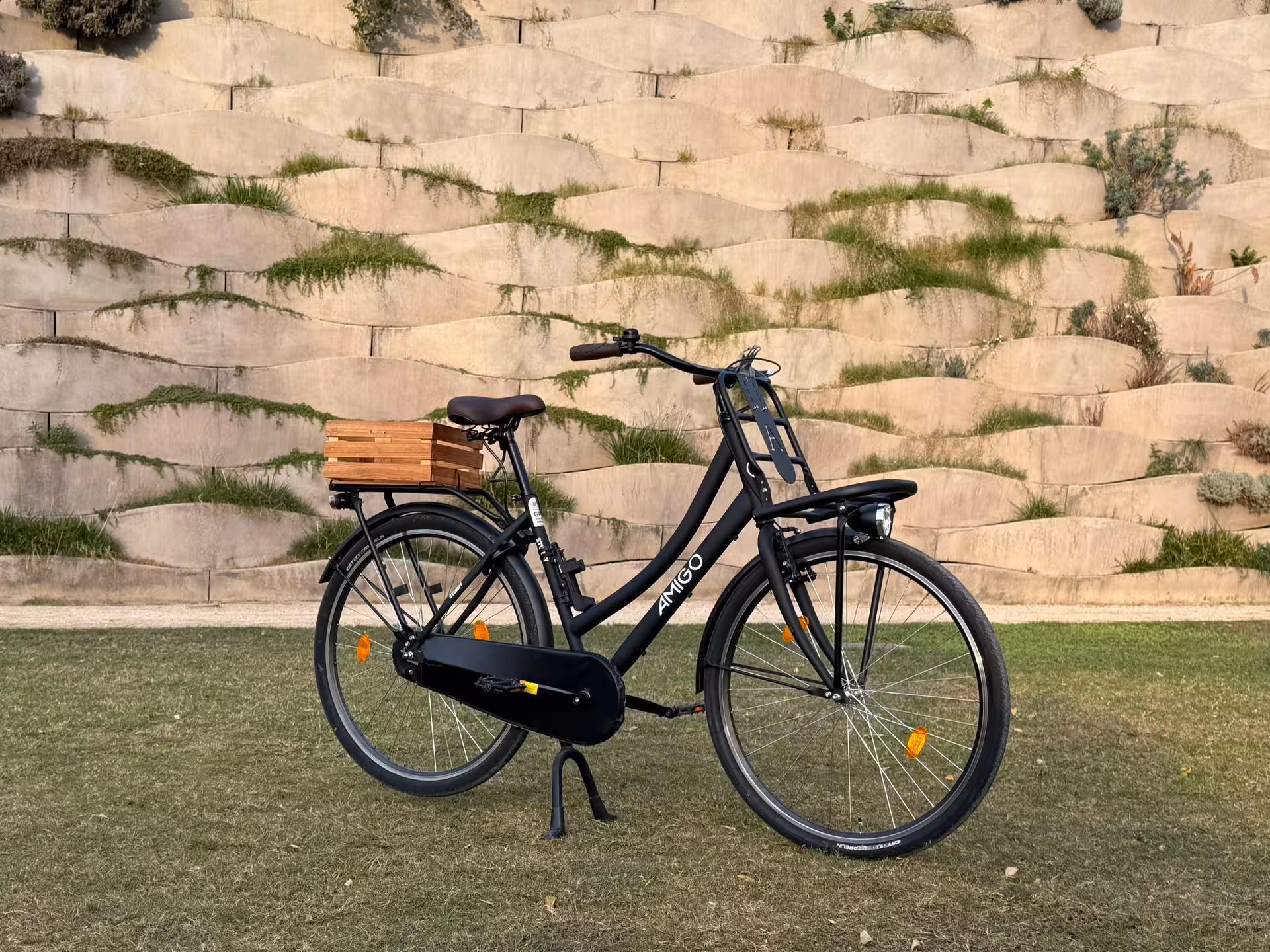 Classic Dutch Omafiets city bike rental with wooden rear crate, comfortable step-through frame for sightseeing