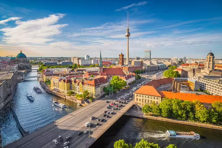 Aerial view of East Berlin skyline with TV Tower, River Spree, and historic city center on a sunny day