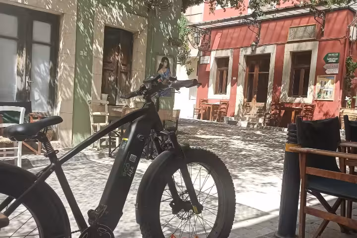 E-bike parked in a charming old town square, ideal for all-inclusive 3-day tour with 2-night overnight stay