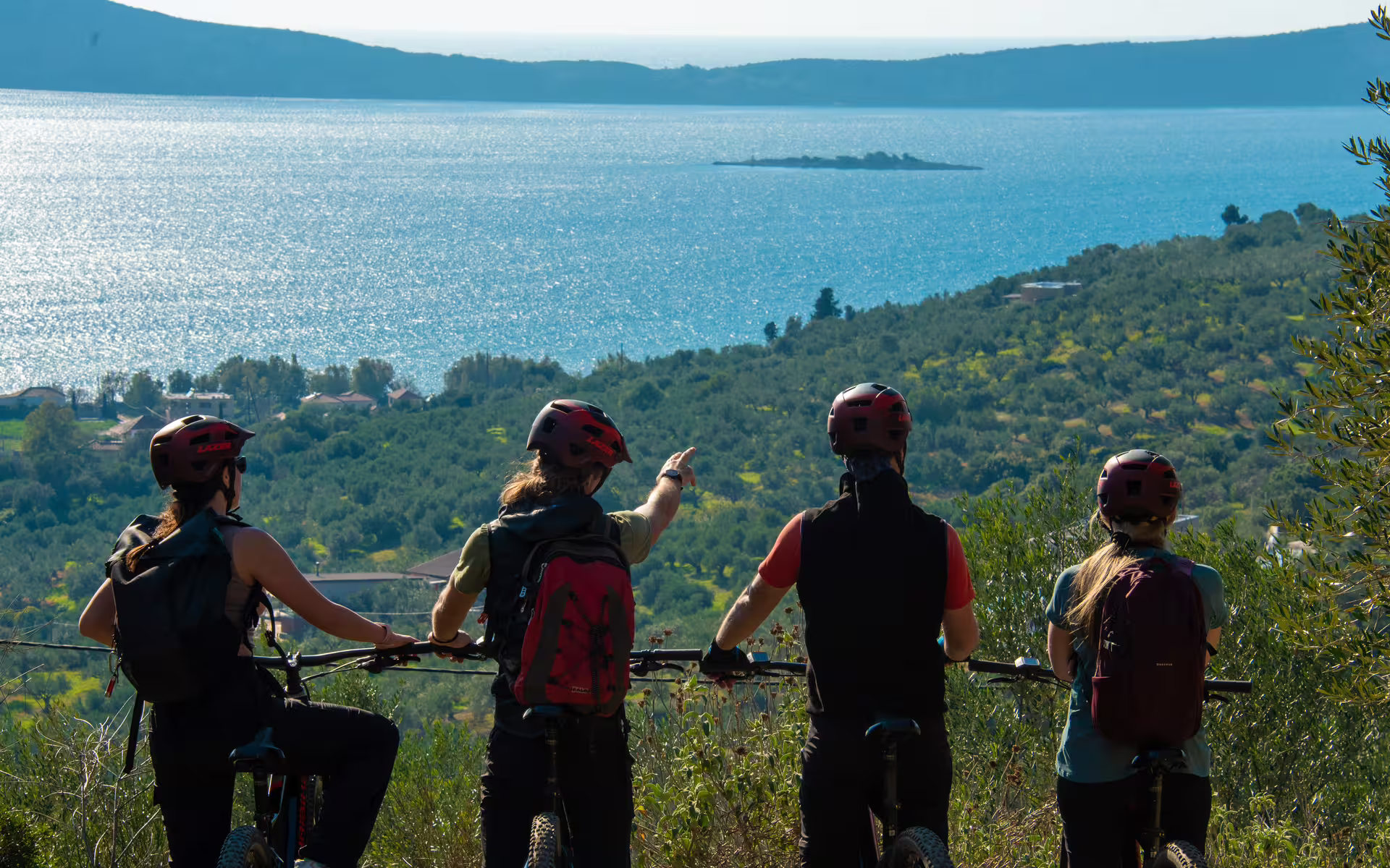 E-Bike Navarino Trail group pausing at a panoramic viewpoint over Navarino Bay and the Ionian Sea coastline