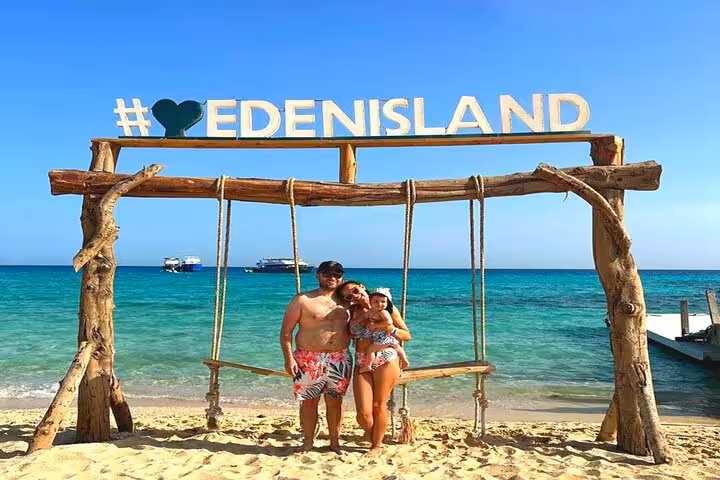 Family photo at #EdenIsland swing on Red Sea beach, Eden Island day trip from Hurghada with lunch