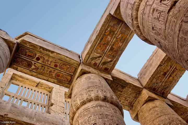 Close-up of ancient hieroglyphs on temple ceiling and columns at Edfu or Kom Ombo on Luxor day trip