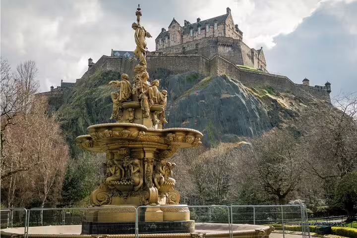Ross Fountain in Princes Street Gardens with Edinburgh Castle perched on volcanic rock behind