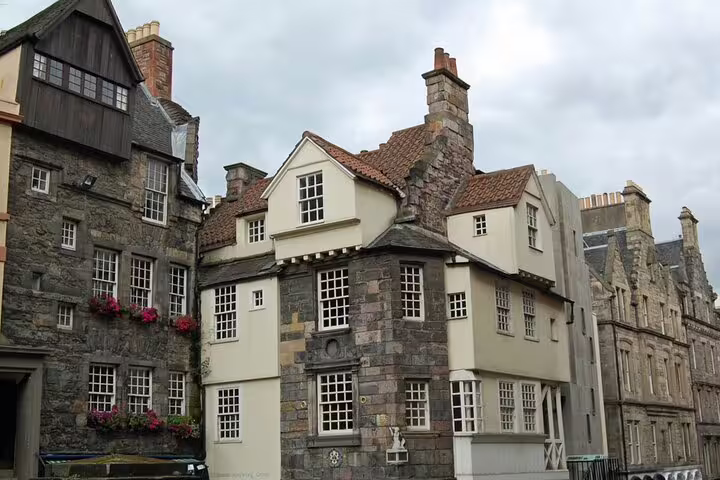 Historic stone buildings with white facades and red tile roofs in Edinburgh's Old Town