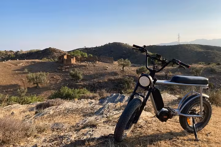 E-fat bike rental overlooking Málaga hills and rural trail landscape, great for a 10-hour adventure at your pace