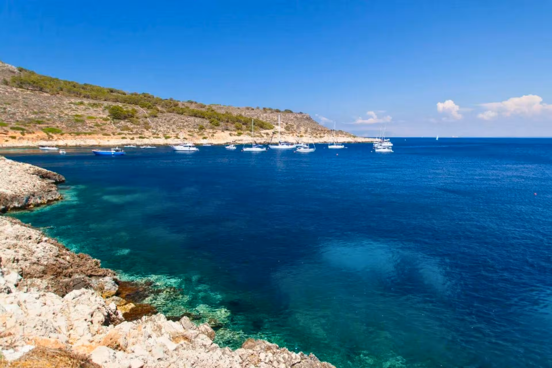 Panoramic Egadi Islands coastline with anchored boats, Favignana and Levanzo day cruise from Trapani with lunch