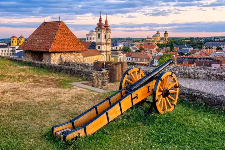 Eger Castle cannon overlooking Eger old town skyline, Hungary, a highlight of Eger wine tasting day trip from Budapest