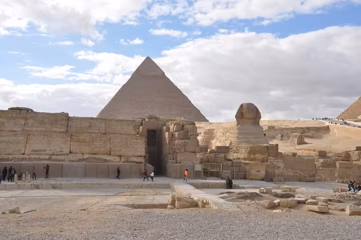 Majestic view of the Great Pyramid and Sphinx under a cloudy sky, a highlight of the 11-day Egypt and Nile tour.