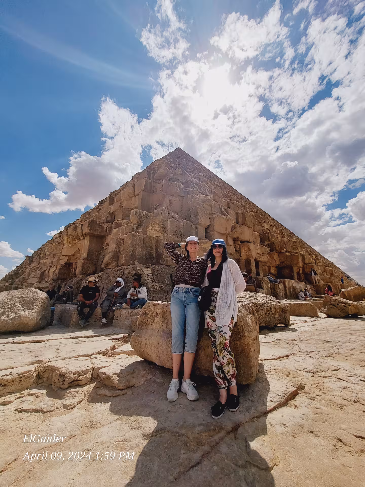 Travelers at the base of the Great Pyramid of Giza on a private Cairo tour, Egypt 4-day itinerary highlight